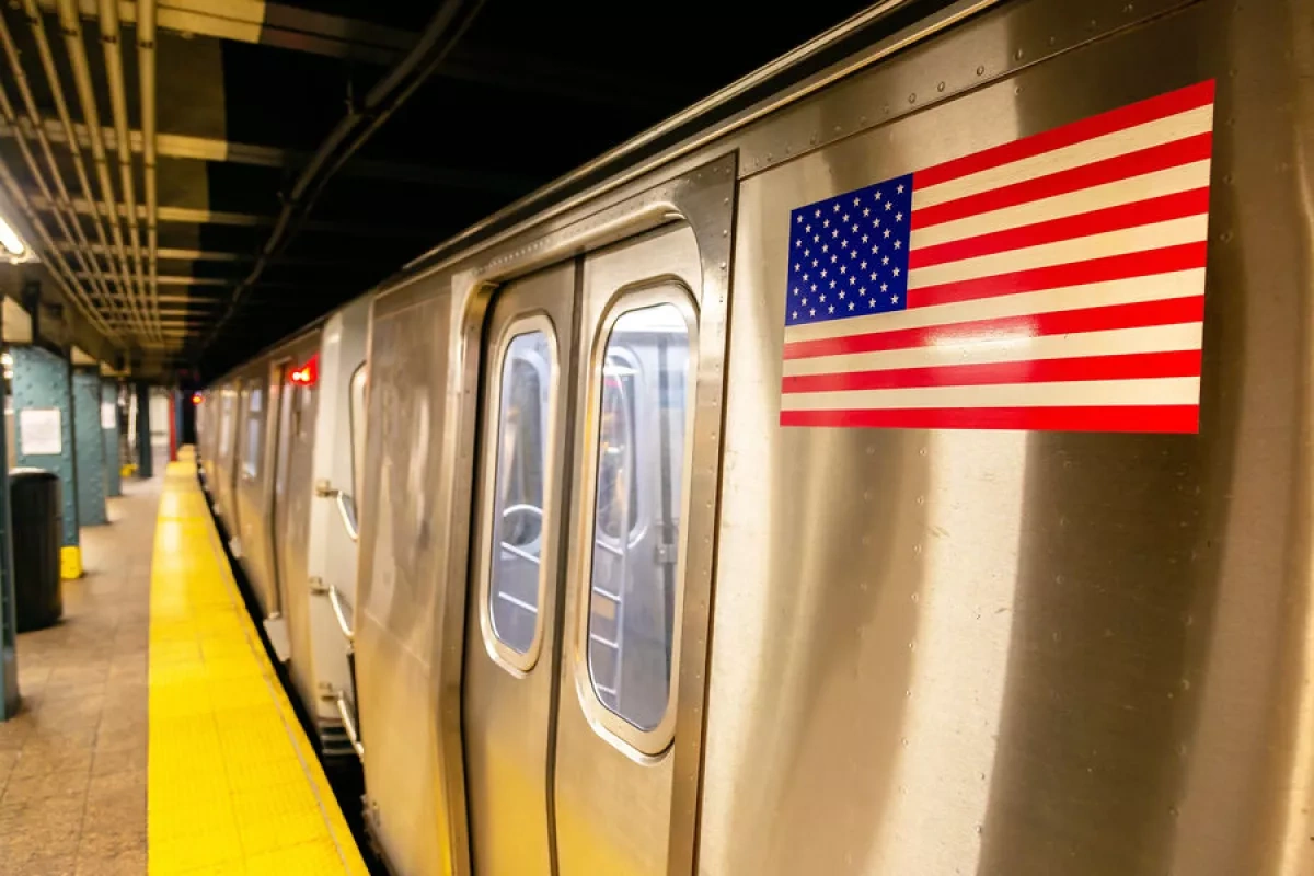 Fire on New York subway train injures 12, disrupts service