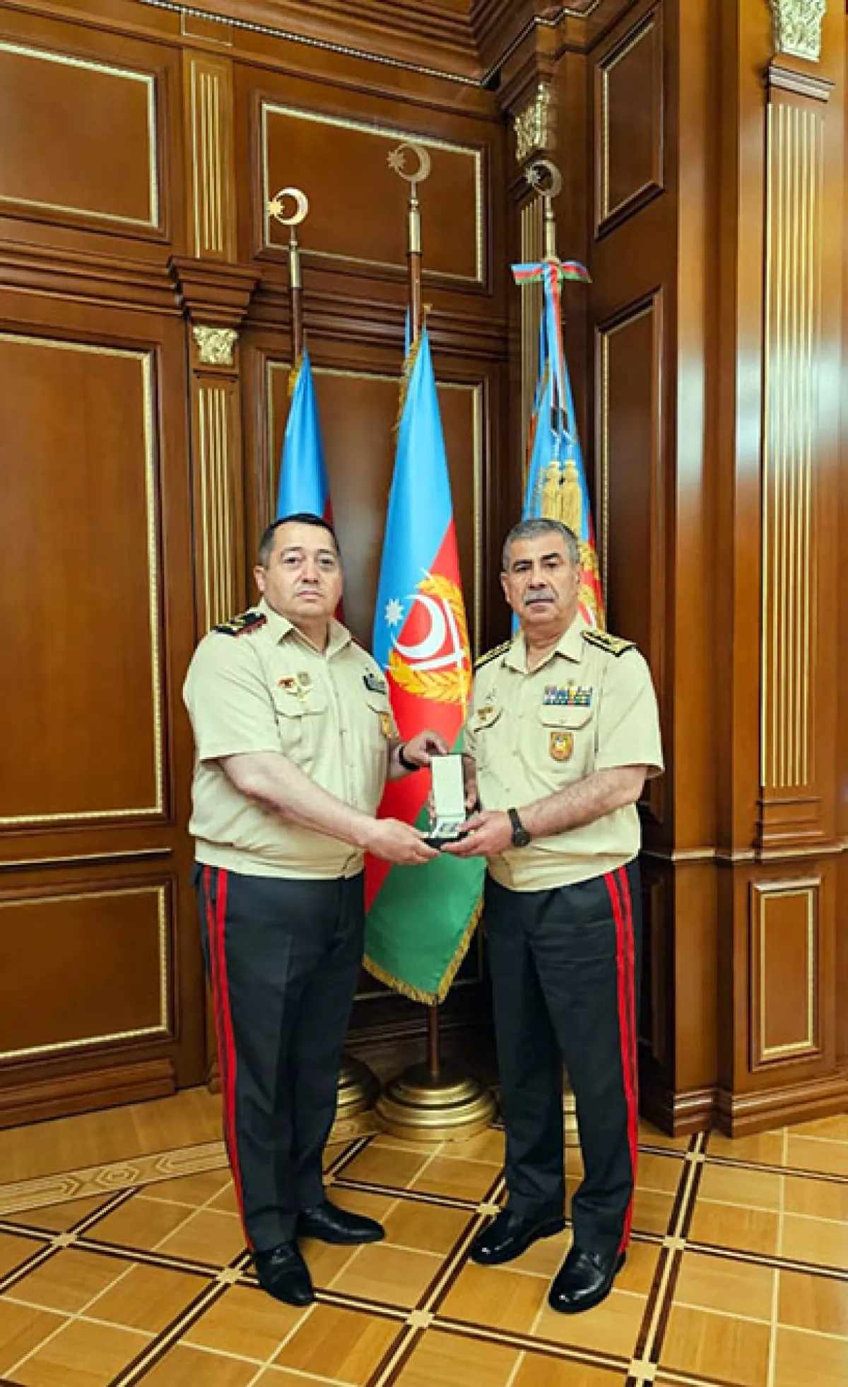 Azerbaijan's defence minister honours director general, group of servicemen