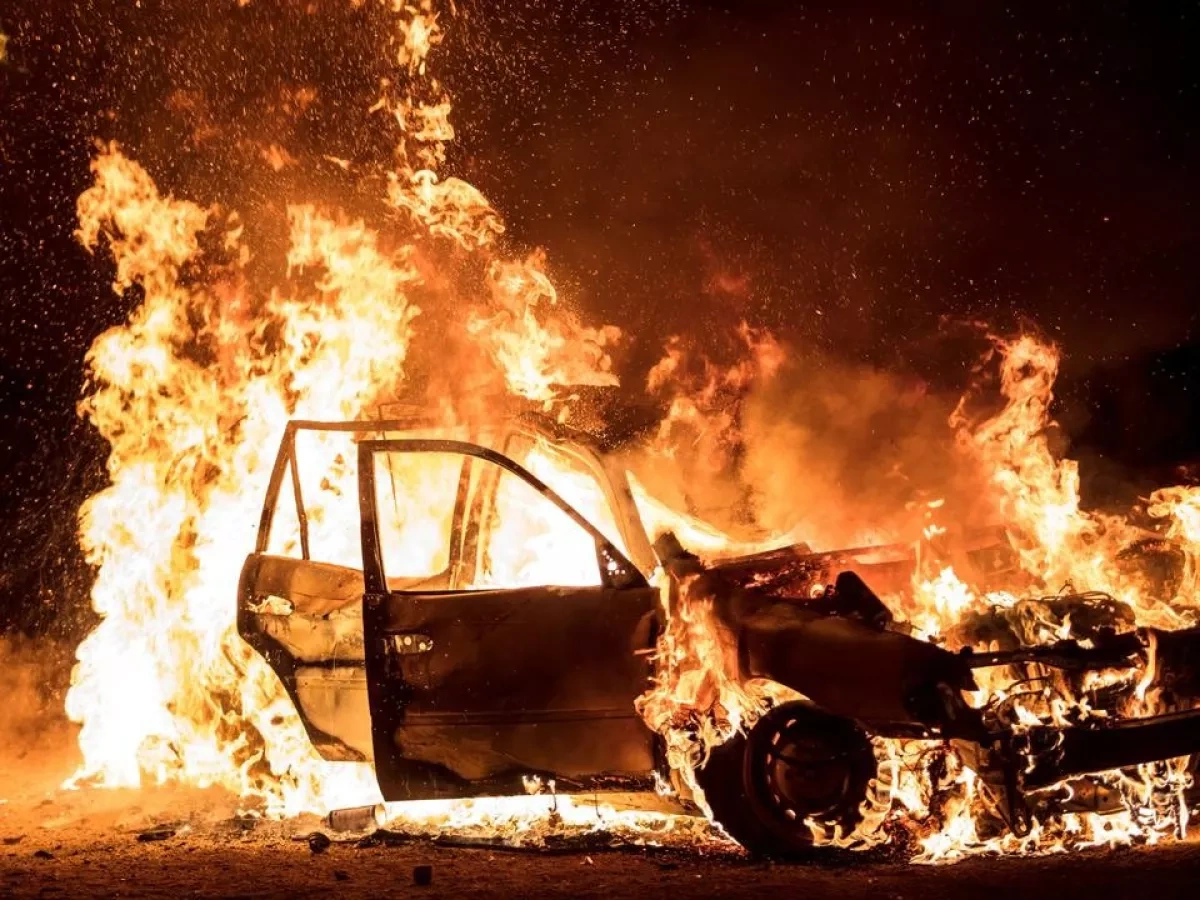 Car dealership catches fire in Kyiv region after drone strike video