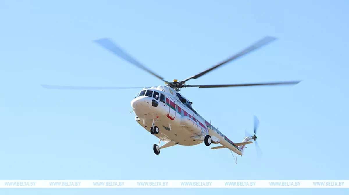 Belarus leader reviews farming season progress from air