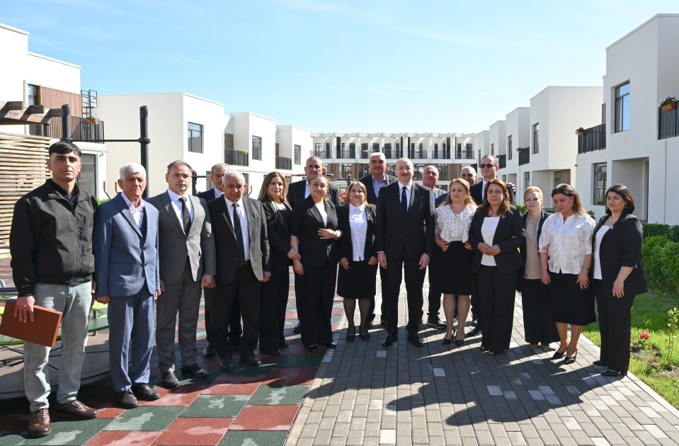 President Ilham Aliyev meets with families moving to first residential complex in Zangilan city (PHOTO)