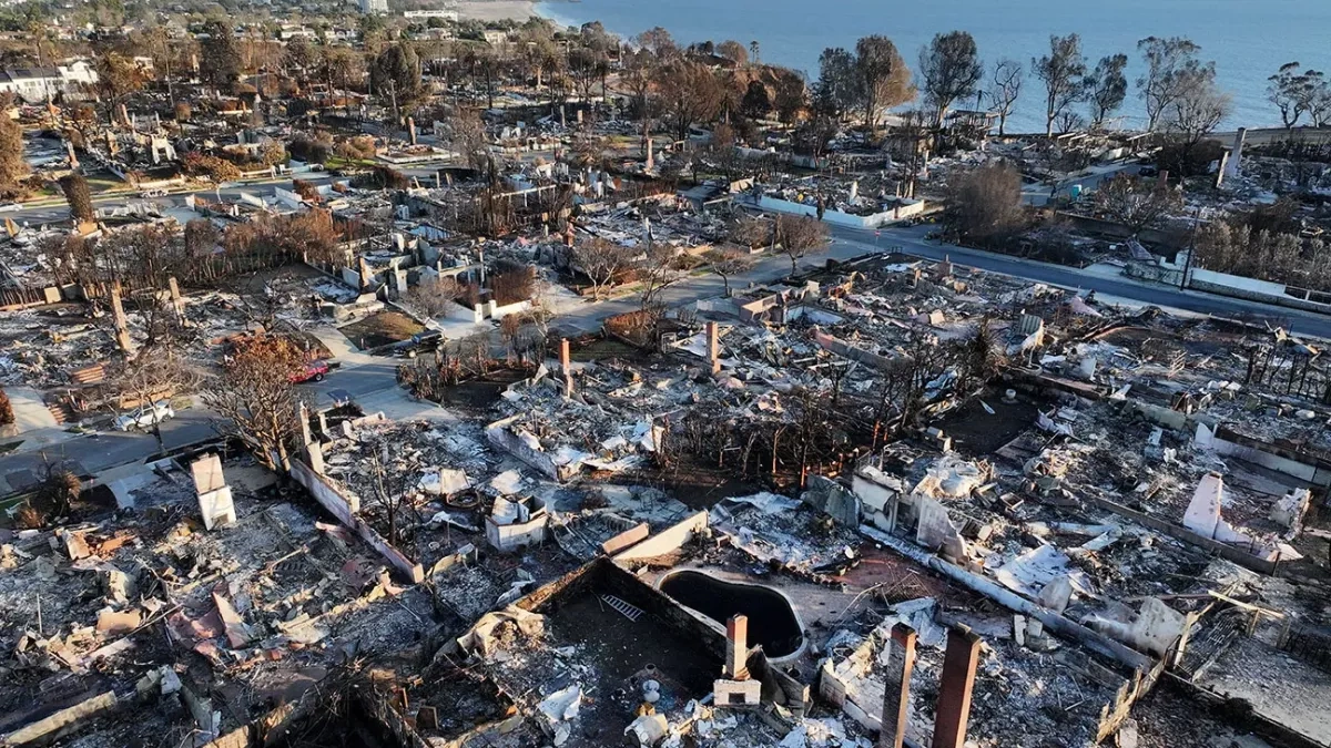 Californians rally in anger over rebuilding efforts one year following LA wildfires
