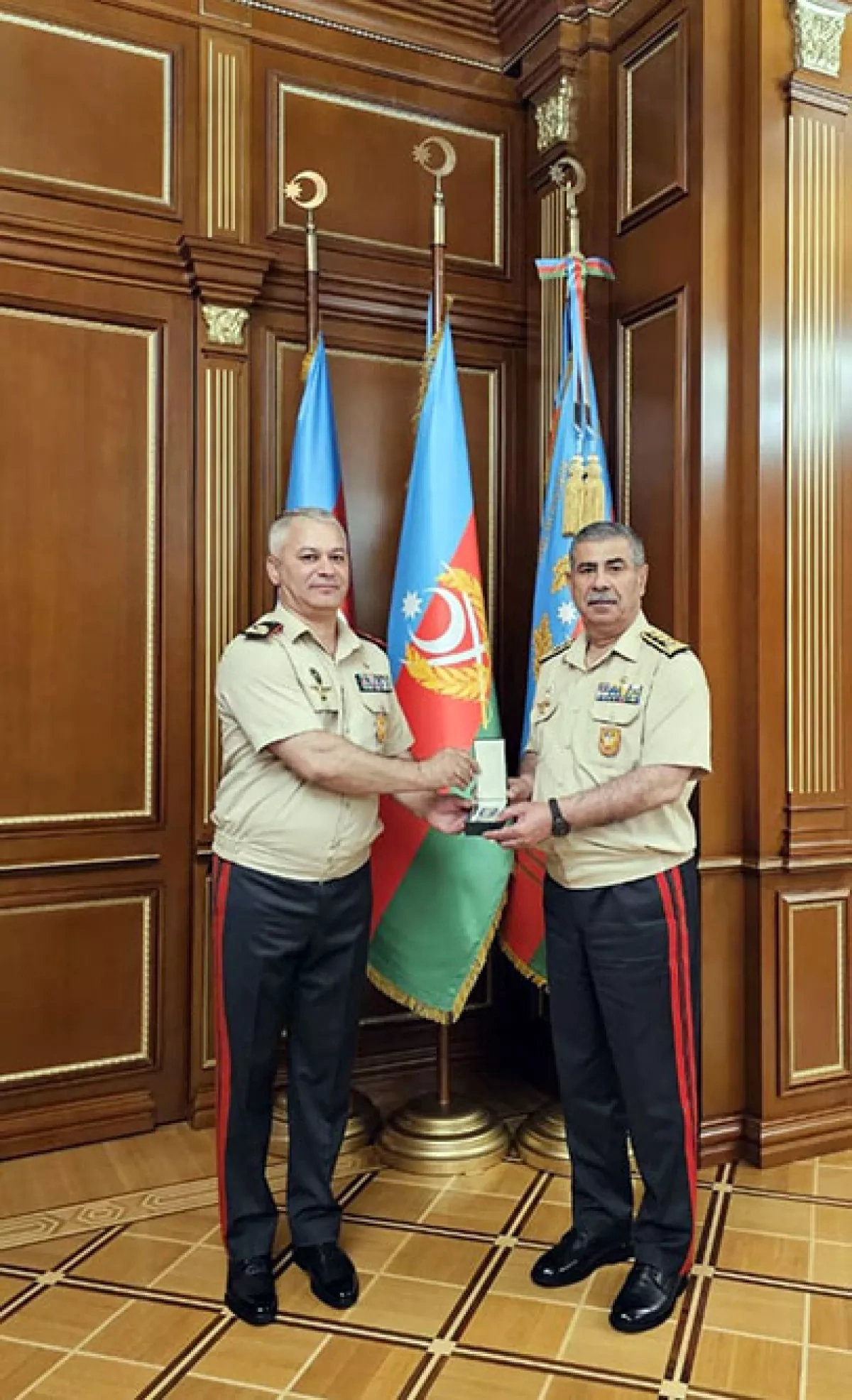 Azerbaijan's defence minister honours director general, group of servicemen