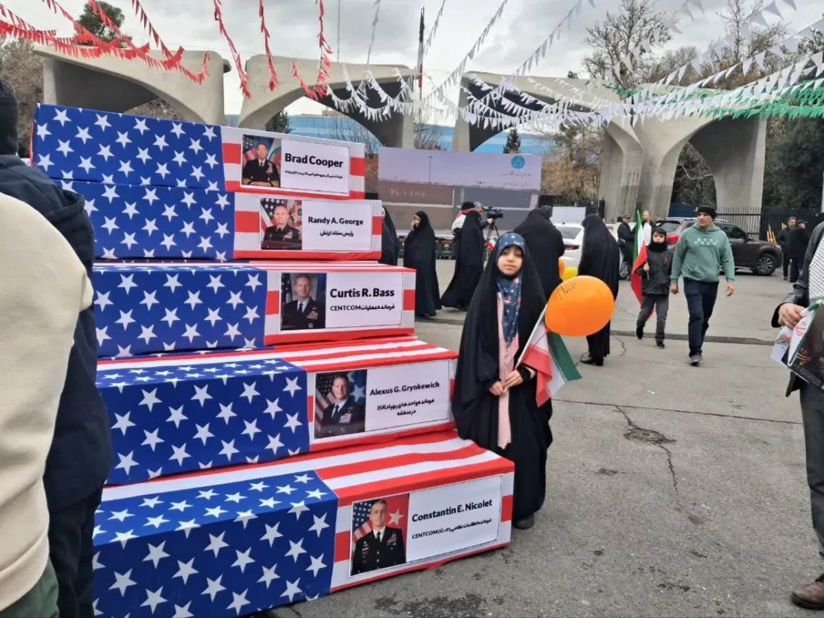 Tehran rally displays mock coffins of top US military officials photo