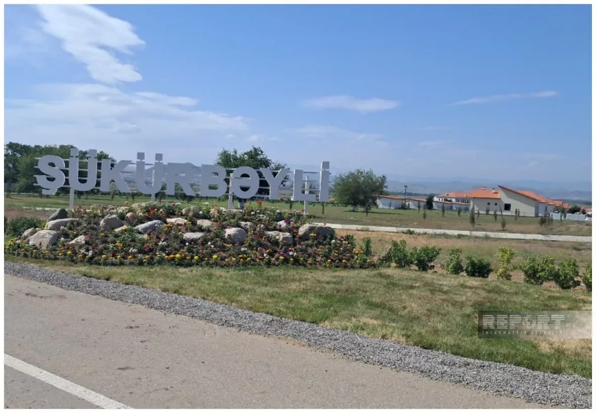 Returning families to Shukurbayli village receive keys to new home