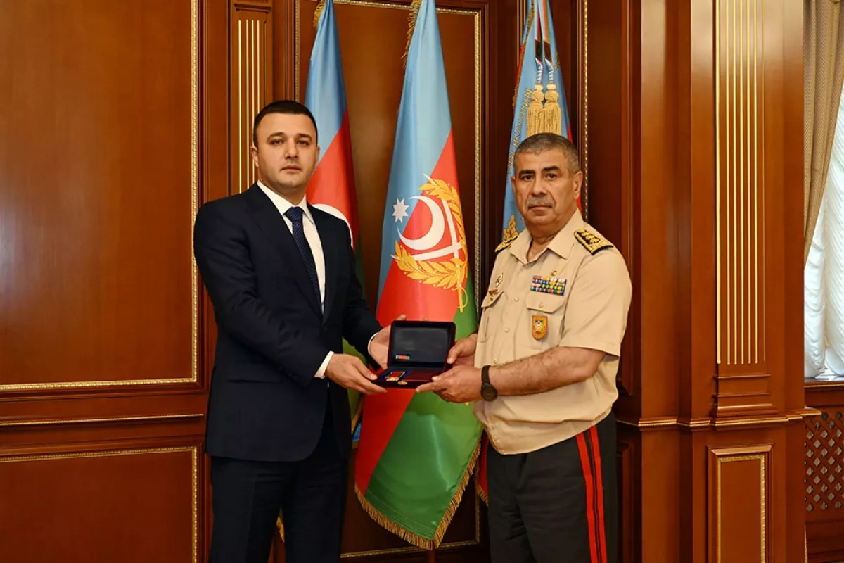 Azerbaijan's defence minister honours director general, group of servicemen