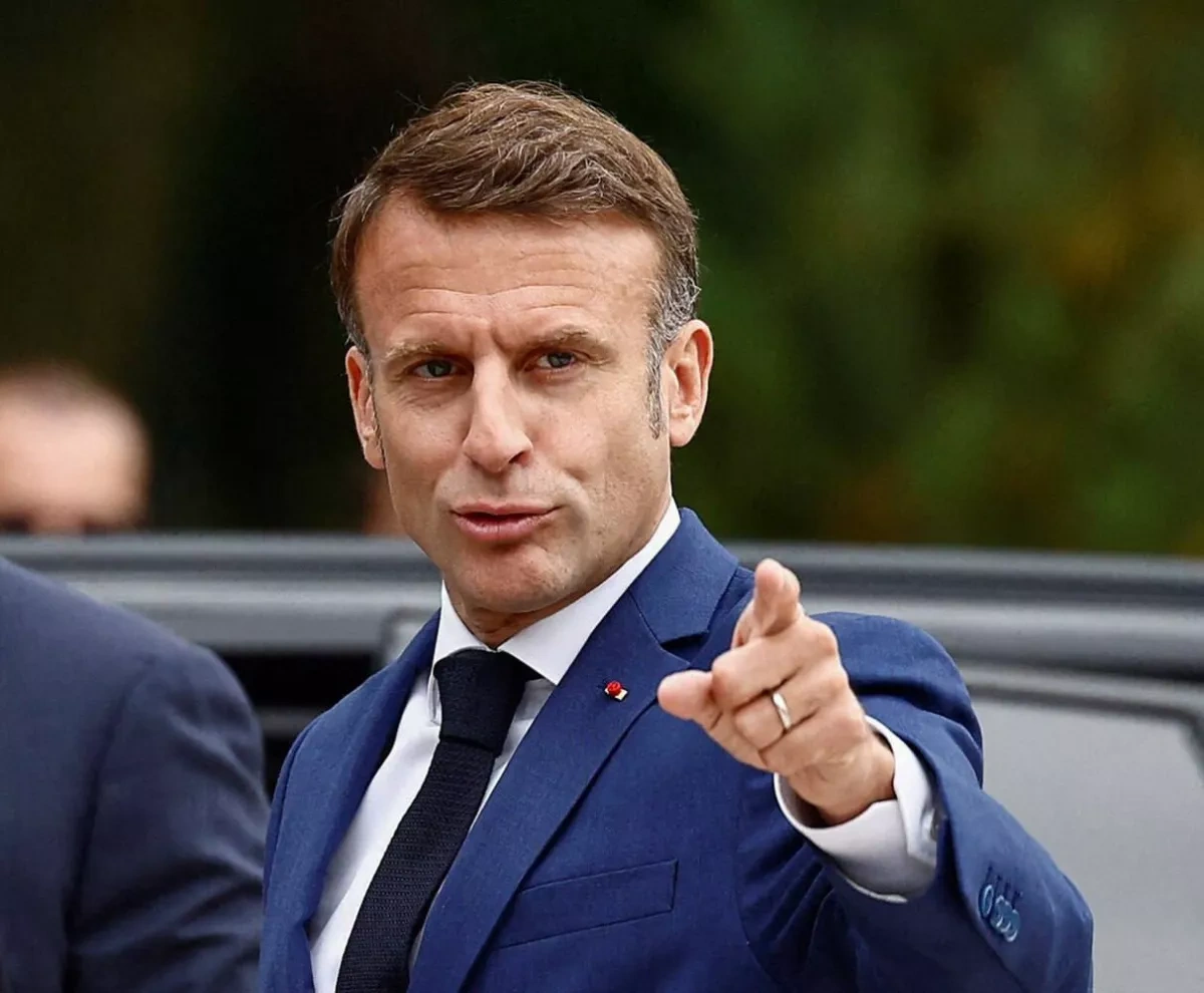 Macron enjoys himself while France burns, French politician says