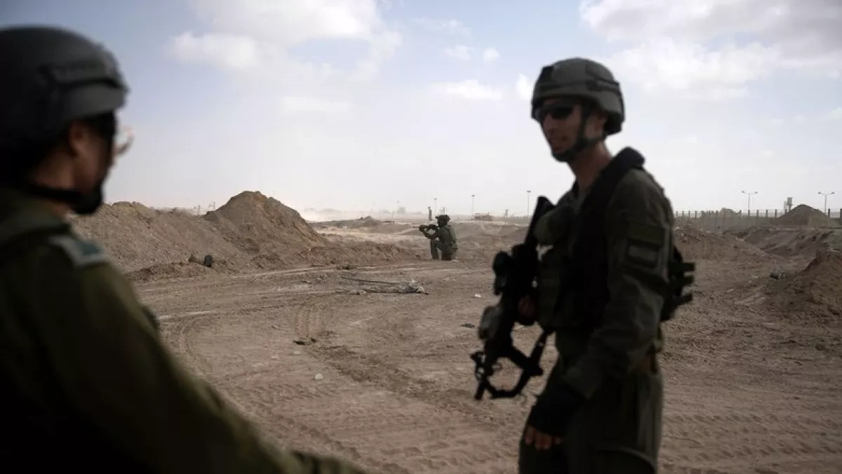 Israeli troops halt group advancing into Syria buffer zone