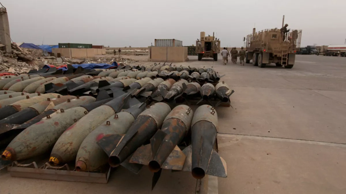 Woman killed by shrapnel after strike on arms depot in Iraq